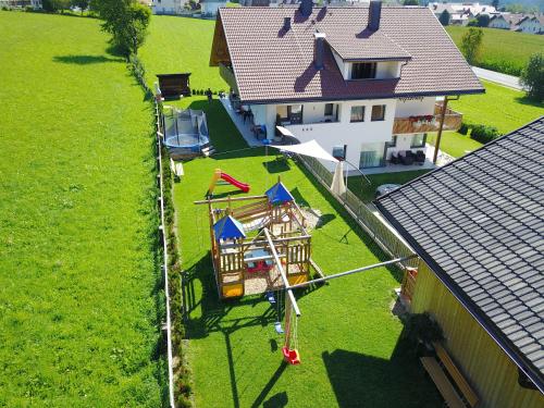 an aerial view of a house with a play yard at Stiflerhof Apt Alpenrose in Falzes