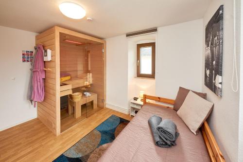 a small room with a bed and a closet at Ferienwohnungen Villa Mosella in Bernkastel-Kues