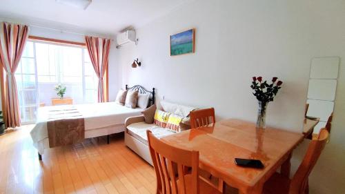a living room with a couch and a table at Lily's home Jing'an Temple in Shanghai