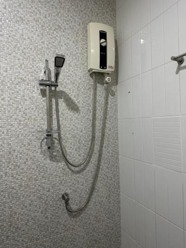 a shower in a bathroom with a soap dispenser at S Villa @Impact Muangthongthani in Pak Kret