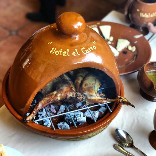 a hotel a casserole dish with food in it at Hotel El Curro in Burunchel