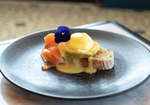 a piece of food on a plate on a table at Only YOU Hotel Valencia in Valencia