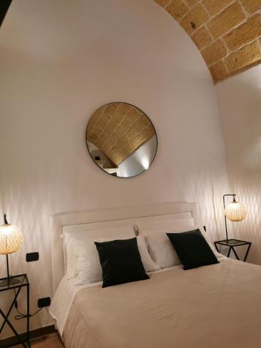 Giường trong phòng chung tại Vecchia Mottola Albergo Diffuso