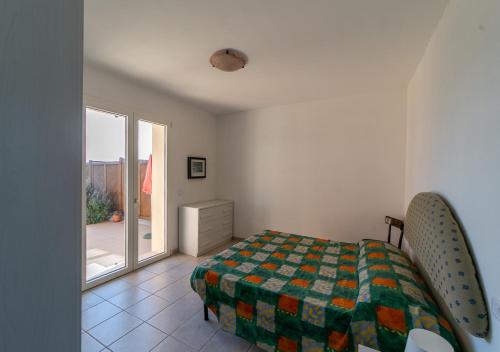A bed or beds in a room at LA DOMIZIANA
