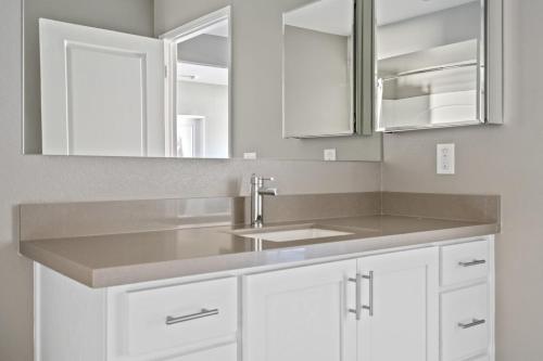 a kitchen with a sink and white cabinets at Santana Row 2br w gym pool nr highways SFO-1156 in San Jose