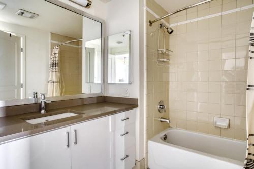 a bathroom with a sink and a tub and a mirror at Mountain View 2BR w Gym Lounge nr Highways SFO-1080 in Los Altos