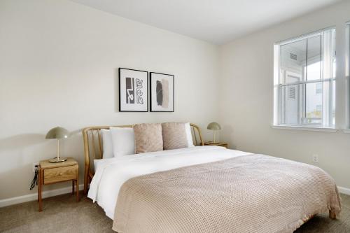 a white bedroom with a bed and two windows at San Mateo 2br w gym pool clubhouse wd nr 101 SFO-1249 in San Mateo