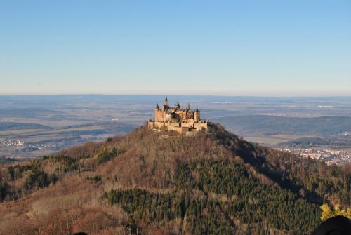 a castle on the top of a hill at Alb Appartements in Albstadt