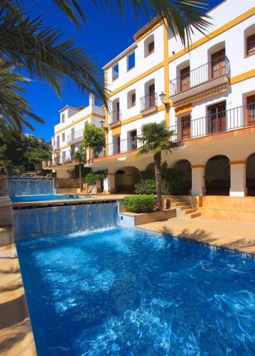 a large swimming pool in front of a building at Ona Las Zarzas in Muntanya la Sella