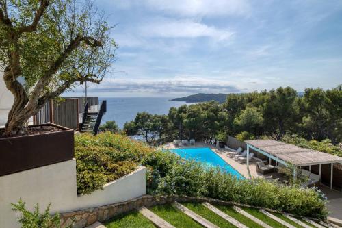 a house with a swimming pool and a view of the ocean at Hauzify I Casa Bonet in Llafranc