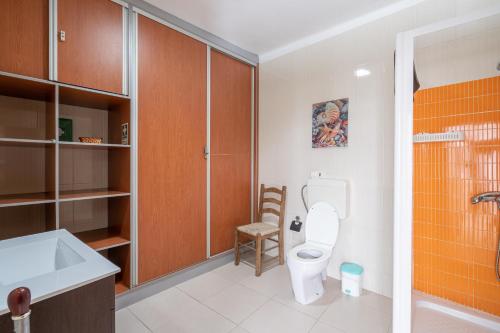 a bathroom with a toilet and a sink at Travessa Albufeira Apartments by Umbral in Albufeira