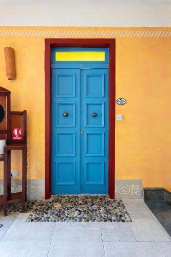 a blue door on the side of a building at Villa Serenity B&B in Sannat