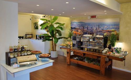 a kitchen with a counter with food on it at Hotel Borgo Brianteo in Ponte San Pietro