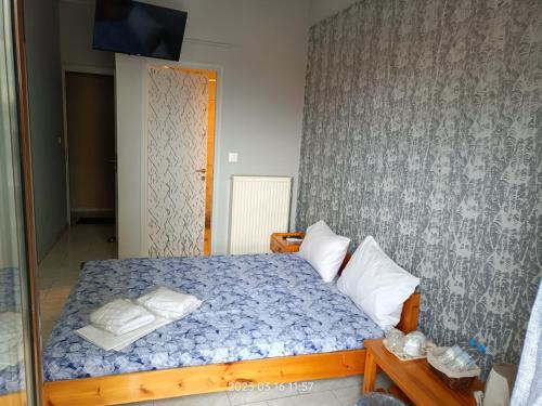 Postel nebo postele na pokoji v ubytování Georgios Rooms