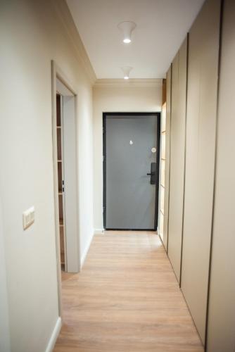 an empty hallway with a door in a building at Opera Apartments in Cluj-Napoca