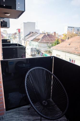 a fan sitting on top of a balcony at Opera Apartments in Cluj-Napoca