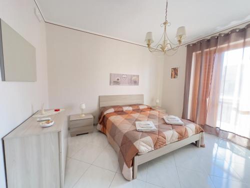 Krevet ili kreveti u jedinici u objektu La pigna delle Aci Apartment