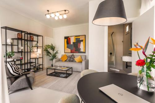 a living room with a table and a couch at Casa San Lio in Noto