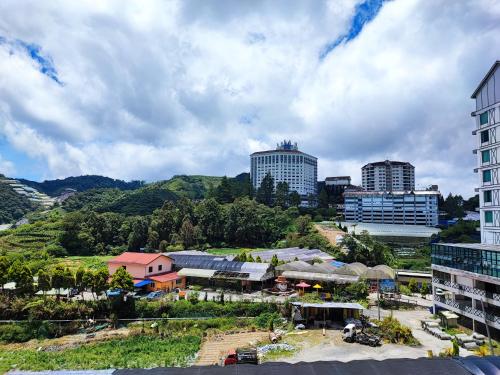 a view of a city with buildings and trees at Muji Homestay @ The Retreat, Cameron Highlands in Cameron Highlands