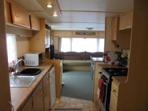 a kitchen and living room of an rv at 8 Berth on The Chase Ingoldmells Nordstar in Skegness