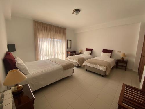Katil atau katil-katil dalam bilik di Fátima GuestHouse