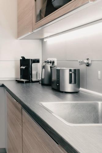 a kitchen counter with appliances on top of it at Soulplace Studioapartment Gelsenkirchen in Gelsenkirchen