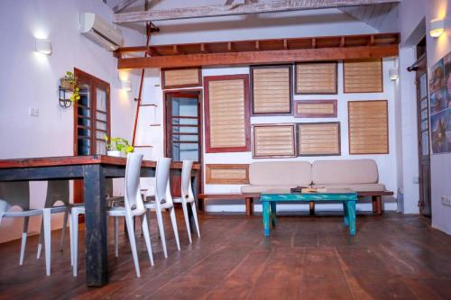 a living room with a couch and chairs and a table at Knight Inn - Galle Fort in Galle