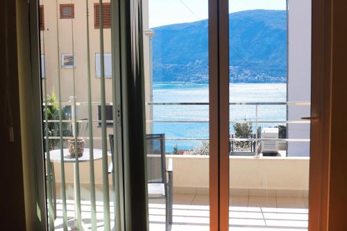 a room with a view of the ocean from a door at Lemon Hill in Herceg-Novi