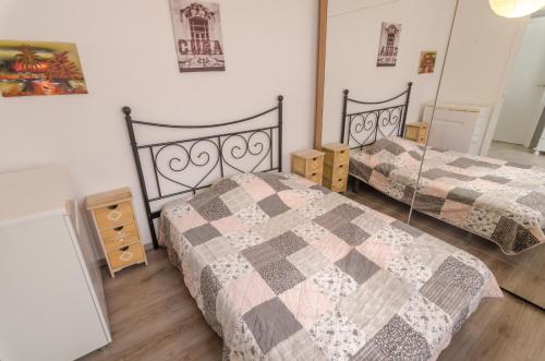 two beds in a room with two beds sidx sidx sidx at Club Villamar - Residencial Park in Maçanet de la Selva