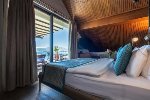 Un pat sau paturi într-o cameră la Perge Hotels - Adult Only 18 plus