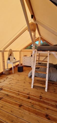 a room with a bunk bed in a tent at BB camping in Liepāja