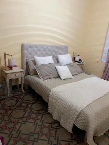 Postel nebo postele na pokoji v ubytování Maison Genevieve