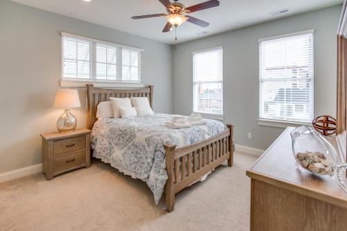 a bedroom with a bed and a ceiling fan at 410A The Jetty House in Virginia Beach