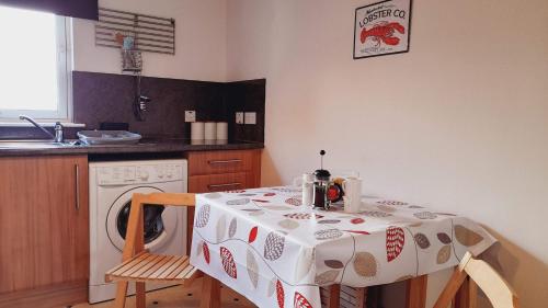 Η κουζίνα ή μικρή κουζίνα στο Beauly Holiday Home