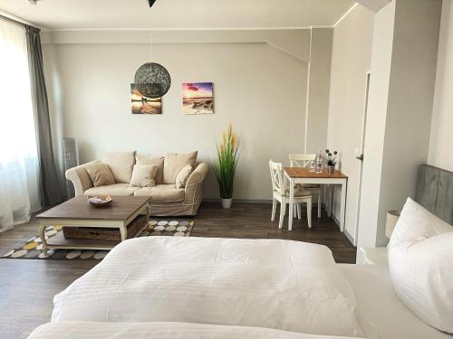 Katil atau katil-katil dalam bilik di Speicher 21 Apartments