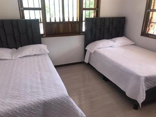 Postel nebo postele na pokoji v ubytování Finca Rosabel cerca a Villeta