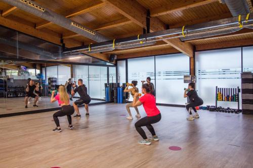 a group of people in a dance class at Oassium Hotel - Adults Only in La Pineda