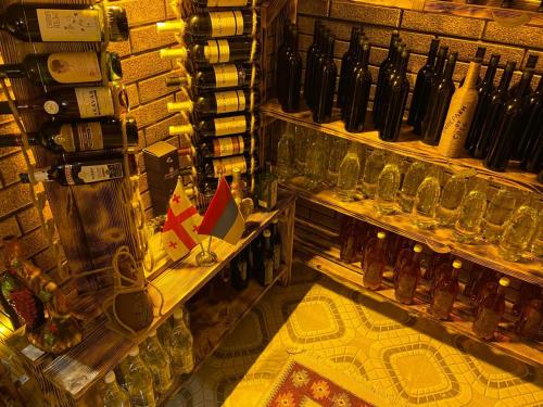 a store filled with lots of bottles and glasses at GUEST HOUSE OCEAN FORCE in Batumi