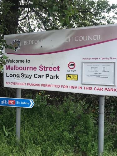 a sign for a melbourne street longstay car park at Penthouse - 2 Bed - 2 Bath - Free Parking in Bedford