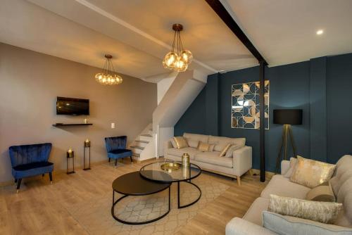 a living room with a couch and a table at Beautiful Triplex in the Center of Paris in Paris