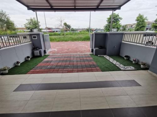 a view of a courtyard with a patio at 88 Cozy House in Kuala Selangor