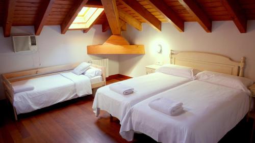 Postel nebo postele na pokoji v ubytování Hotel Branka