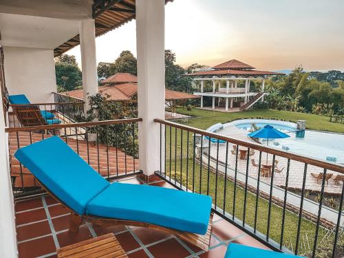 a view of the pool from the balcony of a resort at Casona Montanesa Quindío eje cafetero in Montenegro