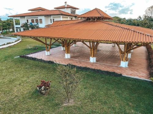 an overhead view of a wooden pavilion in front of a house at Casona Montanesa Quindío eje cafetero in Montenegro