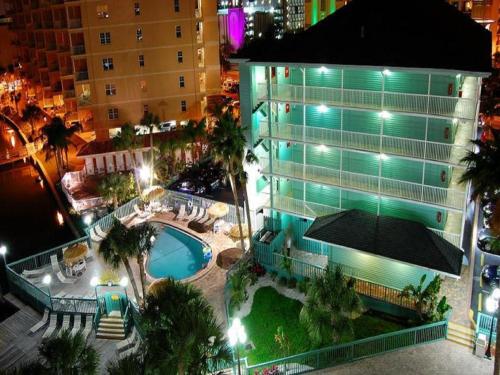 an overhead view of a building with a swimming pool at night at Clearwater Beach Hotel in Clearwater Beach