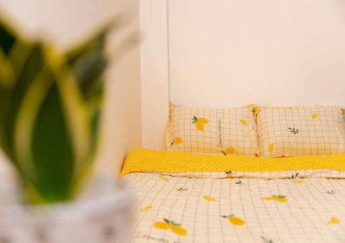 a bed with two pillows with butterflies on it at MTV Homestay Vũng Tàu in Vung Tau