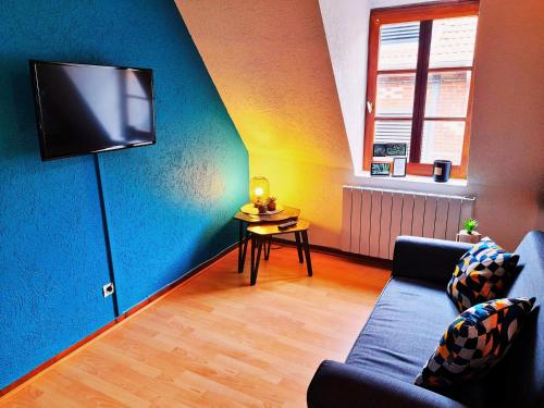 TV a/nebo společenská místnost v ubytování L'Authentique - Appartement Cosy En Hyper Centre