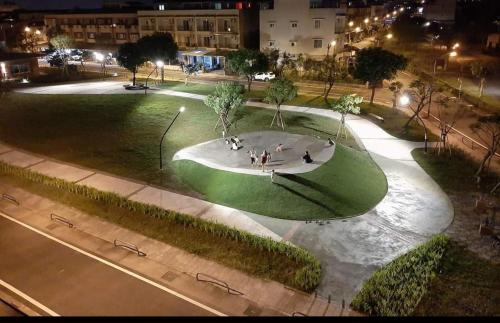 a green park with a skateboard rink in the grass at Yilan Weird Home in Dayin