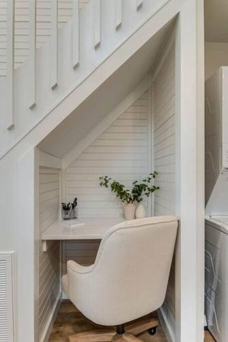 a white staircase with a white chair in a room at Worry B Gone in Tracy City