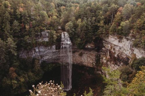 a waterfall on the side of a cliff at Worry B Gone in Tracy City